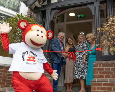 Cutting-the-ribbon-at-Monkey-Puzzle-Guildford-open-day